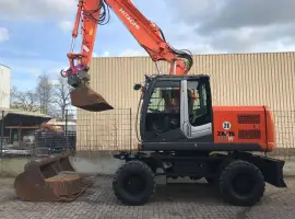 Зображення для оголошення Колесный экскаватор Hitachi Zaxis 140 W