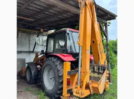 Зображення для оголошення На продаж: екскаватор-навантажувач Амкодор 702ЕМ-03 (2012 рік)
