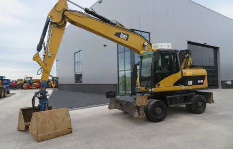 Грейферний перегружатель Caterpillar M318D