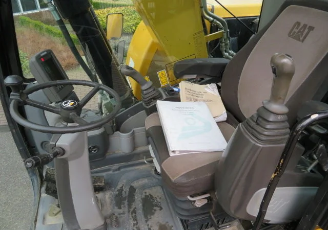 Колесный экскаватор Caterpillar M313D - фото № 3