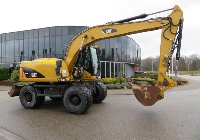 Колесный экскаватор Caterpillar M313D - фото № 5