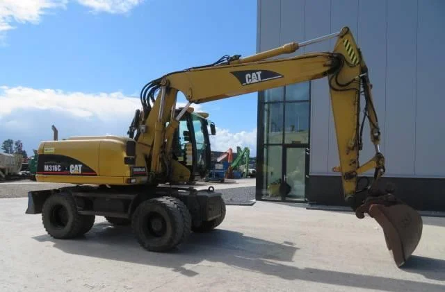 Колёсный экскаватор Caterpillar M316C 2003 года - фото № 1