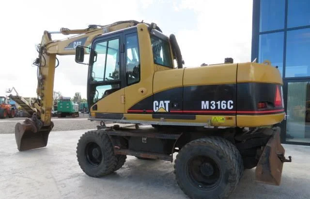 Колёсный экскаватор Caterpillar M316C 2003 года - фото № 3