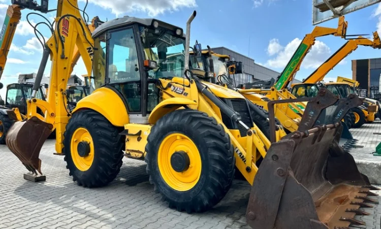 Екскаватор- навантажувач New Holland B115 - 2009 рік - фото № 1