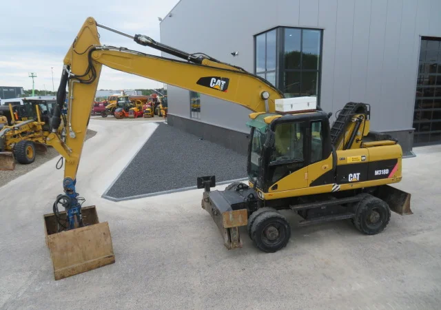 Грейферный перегружатель Caterpillar M318D на продажу - фото № 12