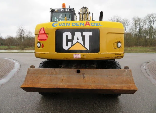 Колесный экскаватор Caterpillar M313D- фото № 2