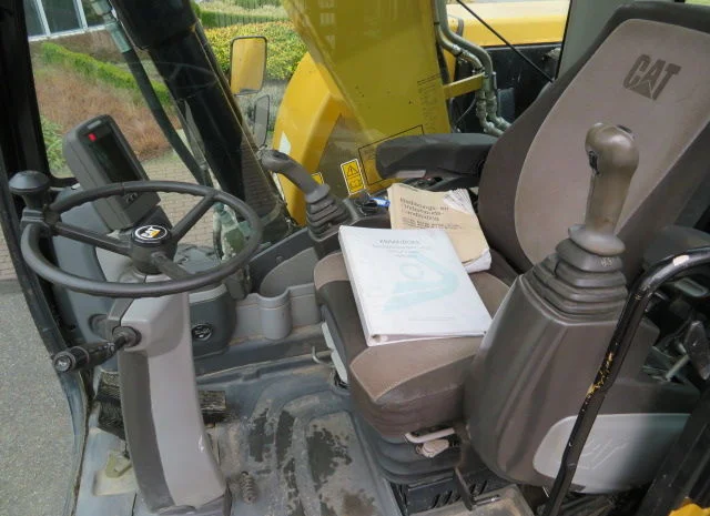Колесный экскаватор Caterpillar M313D- фото № 3
