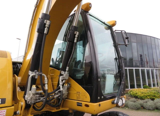 Колесный экскаватор Caterpillar M313D- фото № 7