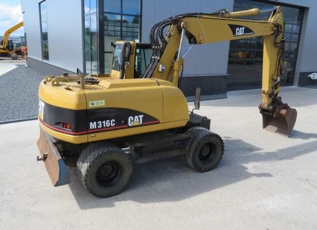 Колёсный экскаватор Caterpillar M316C 2003 года- фото № 5
