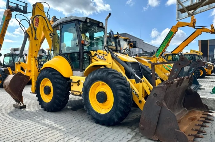 Екскаватор- навантажувач New Holland B115 - 2009 рік- фото № 1