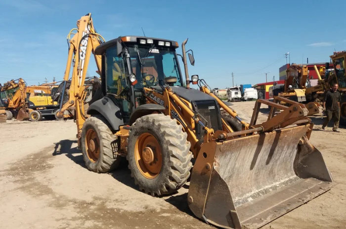 Экскаватор-погрузчик Case 695SR 2009 года- фото № 1