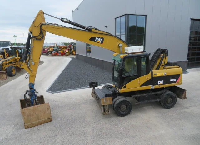 Грейферный перегружатель Caterpillar M318D на продажу- фото № 12