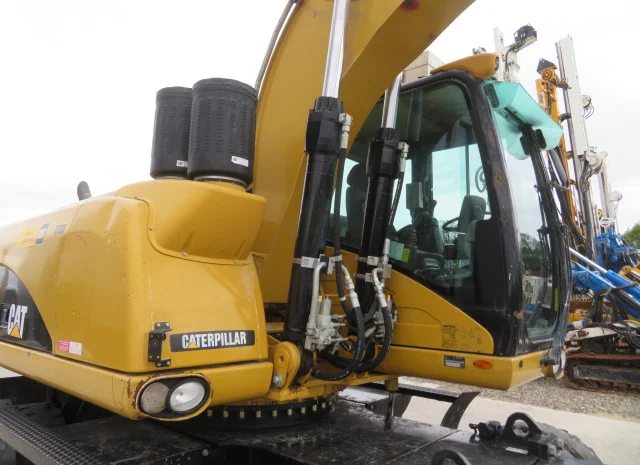 Грейферный перегружатель Caterpillar M318D на продажу- фото № 11